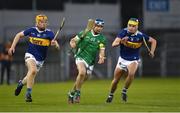 21 April 2023; Liam Dennehy of Limerick in action against Sean Kenneally, 10, and Darragh Stakelum of Tipperary during the oneills.com Munster GAA Hurling U20 Championship Round 4 match between Tipperary and Limerick at FBD Semple Stadium in Thurles, Tipperary. Photo by Stephen Marken/Sportsfile