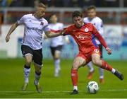 21 April 2023; Kian Leavy of Shelbourne in action against Keith Ward of Dundalk during the SSE Airtricity Men's Premier Division match between Shelbourne and Dundalk at Tolka Park in Dublin. Photo by David Fitzgerald/Sportsfile