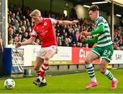 21 April 2023; Jay McGrath of St Patrick's Athletic  in action against Johnny Kenny of Shamrock Rovers during the SSE Airtricity Men's Premier Division match between St Patrick's Athletic and Shamrock Rovers at Richmond Park in Dublin. Photo by Seb Daly/Sportsfile