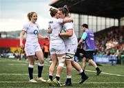 22 April 2023; Sarah Beckett of England celebrates with teammate Claudia MacDonald after scoring her side's first try during the TikTok Women's Six Nations Rugby Championship match between Ireland and England at Musgrave Park in Cork. Photo by Eóin Noonan/Sportsfile