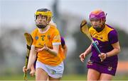 22 April 2023; Dearbhail Dobbin of Antrim in action against Erin McDonald of Wexford during the Electric Ireland Camogie Minor A Shield Semi-Final match between Antrim and Wexford at Coralstown Kinnegad GAA in Westmeath. Photo by Stephen Marken/Sportsfile