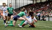 22 April 2023; Tatyana Heard of England scores a try despite the efforts of Lauren Delany of Ireland during the TikTok Women's Six Nations Rugby Championship match between Ireland and England at Musgrave Park in Cork. Photo by Eóin Noonan/Sportsfile