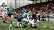 22 April 2023; Tatyana Heard of England scores a try despite the efforts of Lauren Delany of Ireland during the TikTok Women's Six Nations Rugby Championship match between Ireland and England at Musgrave Park in Cork. Photo by Eóin Noonan/Sportsfile