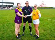22 April 2023; Referee John Burke with Leah Morris of Wexford, left, and Aoibheann Donnelly of Antrim before the Electric Ireland Camogie Minor A Shield Semi-Final match between Antrim and Wexford at Coralstown Kinnegad GAA in Westmeath. Photo by Stephen Marken/Sportsfile