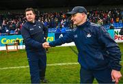 22 April 2023; Antrim manager Darren Gleeson, left, shakes hands with Dublin manager Micheál Donoghue after their side's draw in the Leinster GAA Hurling Senior Championship Round 1 match between Antrim and Dublin at Corrigan Park in Belfast. Photo by Ramsey Cardy/Sportsfile