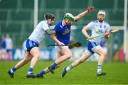 22 April 2023; Diarmaid Carney of Cavan in action against Paddy Finnegan, left, and Colin Merrick of Monaghan during the Lory Meagher Cup Round 2 match between Cavan and Monaghan at Kingspan Breffni in Cavan. Photo by Stephen McCarthy/Sportsfile