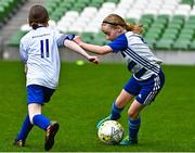 22 April 2023; Kate Ryan of Homefarm FC, Dublin, in action against Rose Daly of Ballinahown FC, Westmeath,  during the Aviva Soccer Sisters Finals Day at the Aviva Stadium in Dublin. Photo by Sam Barnes/Sportsfile
