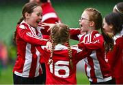22 April 2023; Lusk United players Emily Healy, Neasa Whyte and Caoimhe Whyte celebrate a goal during the Aviva Soccer Sisters Finals Day at the Aviva Stadium in Dublin. Photo by Sam Barnes/Sportsfile