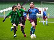 22 April 2023; Aoibheann Stewart of Piltown AFC, Kilkenny, in action against Lucy Brock, left, and Rose Hamilton of Greystones United, Wicklow, during the Aviva Soccer Sisters Finals Day at the Aviva Stadium in Dublin. Photo by Sam Barnes/Sportsfile