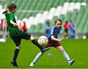 22 April 2023; Isabelle White of Piltown AFC, Kilkenny, in action against Hannah Short of Greystones United, Wicklow, during the Aviva Soccer Sisters Finals Day at the Aviva Stadium in Dublin. Photo by Sam Barnes/Sportsfile