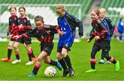 22 April 2023; Aoife Carroll of Mungret Regional FC, Limerick, in action against Róise Gallagher of Kinvara United, Galway, during the Aviva Soccer Sisters Finals Day at the Aviva Stadium in Dublin. Photo by Sam Barnes/Sportsfile