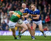 22 April 2023; Paudie Clifford of Kerry is tackled by Willie Eviston and Kevin Fahey of Tipperary during the Munster GAA Football Senior Championship Semi-Final match between Kerry and Tipperary at Fitzgerald Stadium in Killarney, Kerry. Photo by Brendan Moran/Sportsfile
