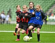 22 April 2023; Róise Gallagher of Kinvara United, Galway, in action against Siun Kelly of Mungret Regional FC, Limerick, during the Aviva Soccer Sisters Finals Day at the Aviva Stadium in Dublin. Photo by Sam Barnes/Sportsfile