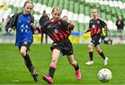 22 April 2023; Róise Gallagher of Kinvara United, Galway, in action against Siun Kelly of Mungret Regional FC, Limerick, during the Aviva Soccer Sisters Finals Day at the Aviva Stadium in Dublin. Photo by Sam Barnes/Sportsfile