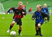 22 April 2023; Nessa Keogh of Mungret Regional FC, Limerick, in action against Róise Gallagher of Kinvara United, Galway, during the Aviva Soccer Sisters Finals Day at the Aviva Stadium in Dublin. Photo by Sam Barnes/Sportsfile