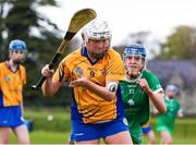 22 April 2023; Aisling Moloney of Clare in action against Donna Kenny of Limerick during the Electric Ireland Camogie Minor A Shield Semi-Final match between Clare and Limerick at St Marys Hurling & Camogie Club in Clonmel, Tipperary. Photo by Michael P Ryan/Sportsfile