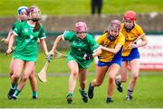 22 April 2023; Ellen Meehan of Limerick in action against Sarah Meade of Clare during the Electric Ireland Camogie Minor A Shield Semi-Final match between Clare and Limerick at St Marys Hurling & Camogie Club in Clonmel, Tipperary. Photo by Michael P Ryan/Sportsfile