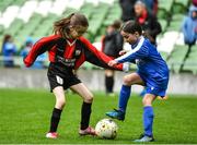22 April 2023; Aine Cooney of Kilworth Celtic, Cork, in action against Ella Gaffney of Dungarvan United, Waterford, during the Aviva Soccer Sisters Finals Day at the Aviva Stadium in Dublin. Photo by Sam Barnes/Sportsfile