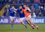 22 April 2023; Stefan Campbell of Armagh in action against Ciarán Brady of Cavan during the Ulster GAA Football Senior Championship quarter-final match between Cavan and Armagh at Kingspan Breffni in Cavan. Photo by Stephen McCarthy/Sportsfile