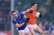 22 April 2023; Jarly Óg Burns of Armagh in action against Gerard Smith of Cavan during the Ulster GAA Football Senior Championship quarter-final match between Cavan and Armagh at Kingspan Breffni in Cavan. Photo by Stephen McCarthy/Sportsfile