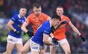 22 April 2023; Dara McVeety of Cavan in action against Rian O'Neill of Armagh during the Ulster GAA Football Senior Championship quarter-final match between Cavan and Armagh at Kingspan Breffni in Cavan. Photo by Stephen McCarthy/Sportsfile