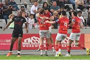 22 April 2023; Calvin Nash of Munster, 3rd from left, celebrates with teammates Mike Haley, Conor Murray and Antoine Frisch after scoring their side's second try during the United Rugby Championship match between Cell C Sharks and Munster at Hollywoodbets Kings Park Stadium in Durban, South Africa. Photo by Darren Stewart/Sportsfile