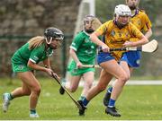 22 April 2023; Aisling Moloney of Clare in action against Ciara Neenan of Limerick during the Electric Ireland Camogie Minor A Shield Semi-Final match between Clare and Limerick at St Marys Hurling & Camogie Club in Clonmel, Tipperary. Photo by Michael P Ryan/Sportsfile