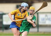 22 April 2023; Caoimhe Cahill of Clare in action against Kate Foley of Limerick during the Electric Ireland Camogie Minor A Shield Semi-Final match between Clare and Limerick at St Marys Hurling & Camogie Club in Clonmel, Tipperary. Photo by Michael P Ryan/Sportsfile
