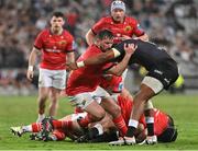 22 April 2023; Diarmuid Barron of Munster is tackled during the United Rugby Championship match between Cell C Sharks and Munster at Hollywoodbets Kings Park Stadium in Durban, South Africa. Photo by Darren Stewart/Sportsfile