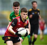 23 April 2023; Rian Magorrian of Down in action against Darragh Hennigan of Donegal during the Ulster GAA Football Minor Championship Group A match between Down and Donegal at Pairc Esler in Newry, Down. Photo by Philip Fitzpatrick/Sportsfile