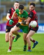 23 April 2023; Finbar Roarty of Donegal in action against Enan Fitzsimons and Corey Clerkin of Down during the Ulster GAA Football Minor Championship Group A match between Down and Donegal at Pairc Esler in Newry, Down. Photo by Philip Fitzpatrick/Sportsfile