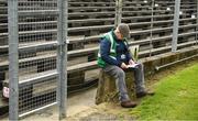 23 April 2023; Meath GAA steward Seán Fox, from Moylagh, Co Meath, reads his programme ahead of the Leinster GAA Football Senior Championship Quarter-Final match between Westmeath and Louth at Páirc Tailteann in Navan, Meath. Photo by Daire Brennan/Sportsfile