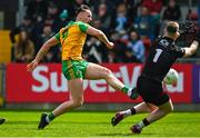 23 April 2023; Jason McGee of Donegal scores his side's first goal past Down goalkeeper Niall Kane during the Ulster GAA Football Senior Championship Quarter-Final match between Down and Donegal at Pairc Esler in Newry, Down. Photo by Ramsey Cardy/Sportsfile