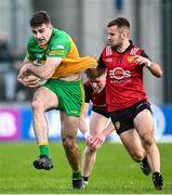 23 April 2023; Caolan McGonagle of Donegal in action against Miceal Rooney, centre, and Donach McAleenan of Down during the Ulster GAA Football Senior Championship Quarter-Final match between Down and Donegal at Pairc Esler in Newry, Down. Photo by Ramsey Cardy/Sportsfile