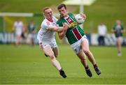 23 April 2023; John Heslin of Westmeath in action against Donal Mckenny of Louth during the Leinster GAA Football Senior Championship Quarter-Final match between Westmeath and Louth at Páirc Tailteann in Navan, Meath. Photo by Daire Brennan/Sportsfile