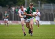 23 April 2023; John Heslin of Westmeath in action against Dan Corcoran of Louth during the Leinster GAA Football Senior Championship Quarter-Final match between Westmeath and Louth at Páirc Tailteann in Navan, Meath. Photo by Daire Brennan/Sportsfile