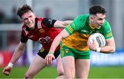 23 April 2023; Caolan McColgan of Donegal in action against Miceal Rooney of Down during the Ulster GAA Football Senior Championship Quarter-Final match between Down and Donegal at Pairc Esler in Newry, Down. Photo by Ramsey Cardy/Sportsfile