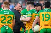 23 April 2023; Donegal interim manager Aidan O'Rourke, left, and selector Paddy Bradley speaks to their players before the Ulster GAA Football Senior Championship Quarter-Final match between Down and Donegal at Pairc Esler in Newry, Down. Photo by Ramsey Cardy/Sportsfile