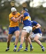 23 April 2023; Conor Cleary of Clare is tackled by Alan Tynan, left, and Seamus Kennedy of Tipperary during the Munster GAA Hurling Senior Championship Round 1 match between Clare and Tipperary at Cusack Park in Ennis, Clare. Photo by John Sheridan/Sportsfile.