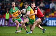 23 April 2023; Eoghan Ban Gallagher of Donegal in action against Liam Kerr of Down during the Ulster GAA Football Senior Championship Quarter-Final match between Down and Donegal at Pairc Esler in Newry, Down. Photo by Ramsey Cardy/Sportsfile