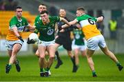 23 April 2023; Jordan Morris of Meath is tackled by Jamie Evans, left, and Peter Cunningham of Offaly during the Leinster GAA Football Senior Championship Quarter-Final match between Offaly and Meath at Glenisk O'Connor Park in Tullamore, Offaly. Photo by Eóin Noonan/Sportsfile