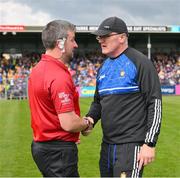 23 April 2023; Clare manager Brian Lohan in conversation with referee Thomas Walsh before the Munster GAA Hurling Senior Championship Round 1 match between Clare and Tipperary at Cusack Park in Ennis, Clare. Photo by Ray McManus/Sportsfile