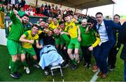 23 April 2023; Rockmount AFC players and staff celebrate with Cian Leonard, who got injured during the match, after the FAI Intermediate Cup Final 2022/23 match between Cockhill Celtic and Rockmount AFC at The Showgrounds in Sligo. Photo by Ben McShane/Sportsfile