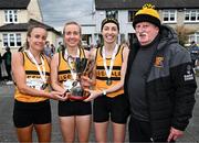 23 April 2023; Cork olympian Donie Walsh, right, and the Leevale AC, Cork, senior women's team, from left, Michelle Finn, Niamh Moore and Lizzie Lee, with the cup after winning the senior women's event during the 123.ie National Road Relay Championships at Raheny in Dublin. Photo by Sam Barnes/Sportsfile