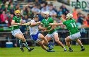 23 April 2023; Darragh Lyons of Waterford in action against Limerick players, from left, Seamus Flanagan, Aaron Gillane and Cian Lynch during the Munster GAA Hurling Senior Championship Round 1 match between Waterford and Limerick at FBD Semple Stadium in Thurles, Tipperary. Photo by Stephen McCarthy/Sportsfile