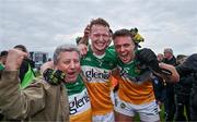 23 April 2023; Offaly supporter Mick McDonagh celebrates with Offaly players Ciaran Donnelly, centre, and Joe Maher after their side's victory in the Leinster GAA Football Senior Championship Quarter-Final match between Offaly and Meath at Glenisk O'Connor Park in Tullamore, Offaly. Photo by Eóin Noonan/Sportsfile