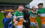 23 April 2023; David Dempsey of Offaly celebrates with a supporter after his side's victory in the Leinster GAA Football Senior Championship Quarter-Final match between Offaly and Meath at Glenisk O'Connor Park in Tullamore, Offaly. Photo by Eóin Noonan/Sportsfile