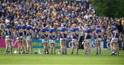23 April 2023; The Tipperary first 15 stand during the playing of the National Anthem before the Munster GAA Hurling Senior Championship Round 1 match between Clare and Tipperary at Cusack Park in Ennis, Clare. Photo by John Sheridan/Sportsfile.