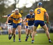 23 April 2023;Conor Cleary of Clare under pressure from Tipperary players, Seamus Kennedy left, and Alan Tynan, passes to his teammate Diarmuid Ryan during the Munster GAA Hurling Senior Championship Round 1 match between Clare and Tipperary at Cusack Park in Ennis, Clare. Photo by John Sheridan/Sportsfile.