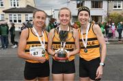 23 April 2023; The Leevale AC, Cork, senior women's team, from left, Michelle Finn, Niamh Moore and Lizzie Lee, with the cup after winning the senior women's event during the 123.ie National Road Relay Championships at Raheny in Dublin. Photo by Sam Barnes/Sportsfile